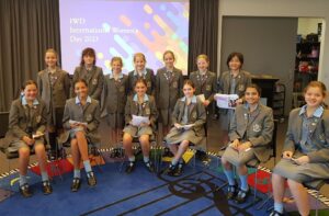 Year 6 International Women’s Day Assembly presenters.<br /> Back row: Jessica Davies, Adison Plunkett, Chloe Deane-Freeman, Sophia McKinnon, Pearl Lee, Vita Wei<br /> Front row: Portia Carosa-Koziora, Joy Lovegrove, Alexandra Pitt, Chloe McMahon, Bella Kadam and Teegan Gobel